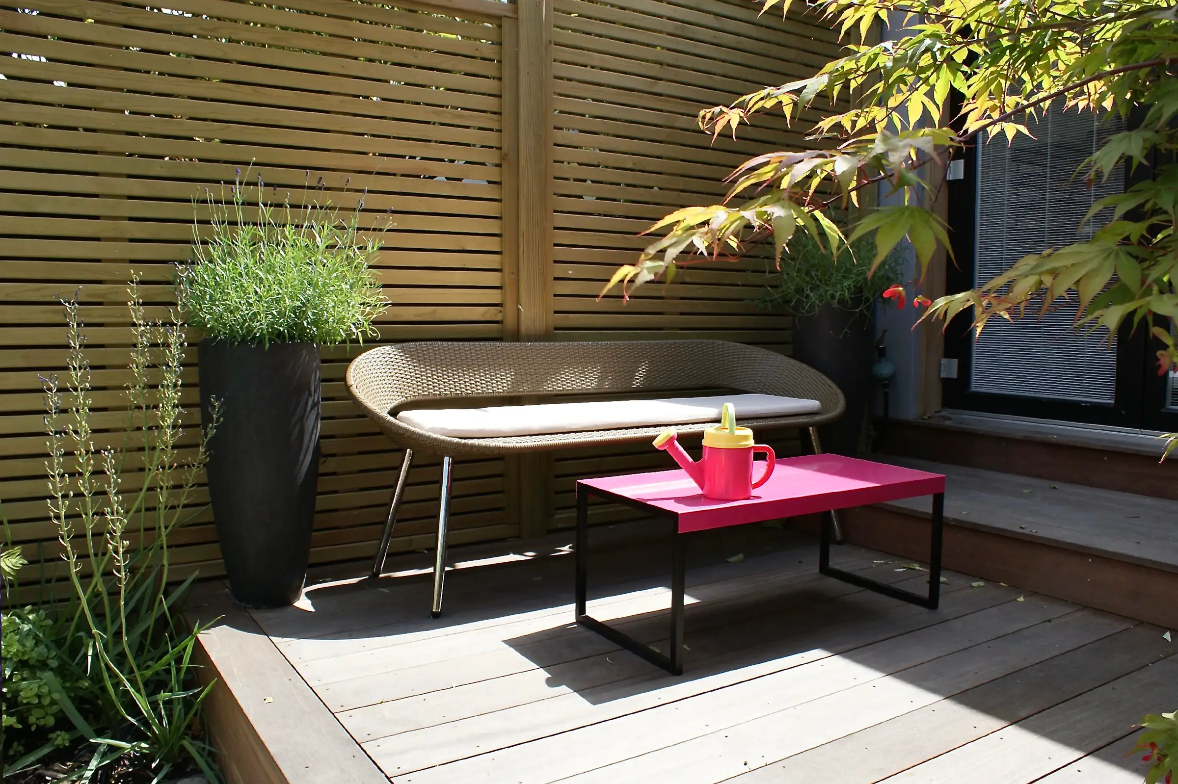 A garden with modern, soft and airy planting with splashes of colour.