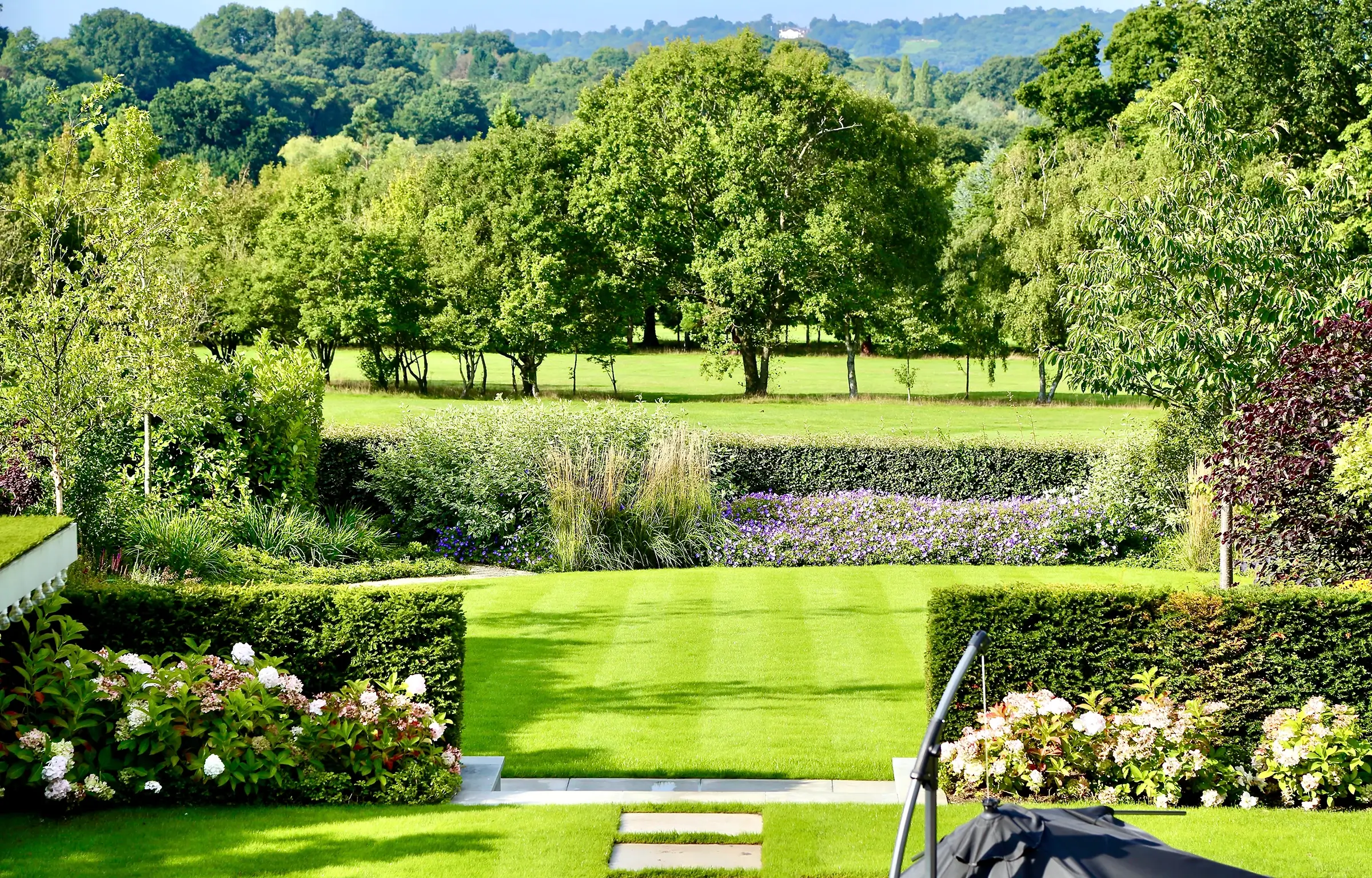 An elevated garden in Hertfordshire with expansive views to a borrowed landscape.