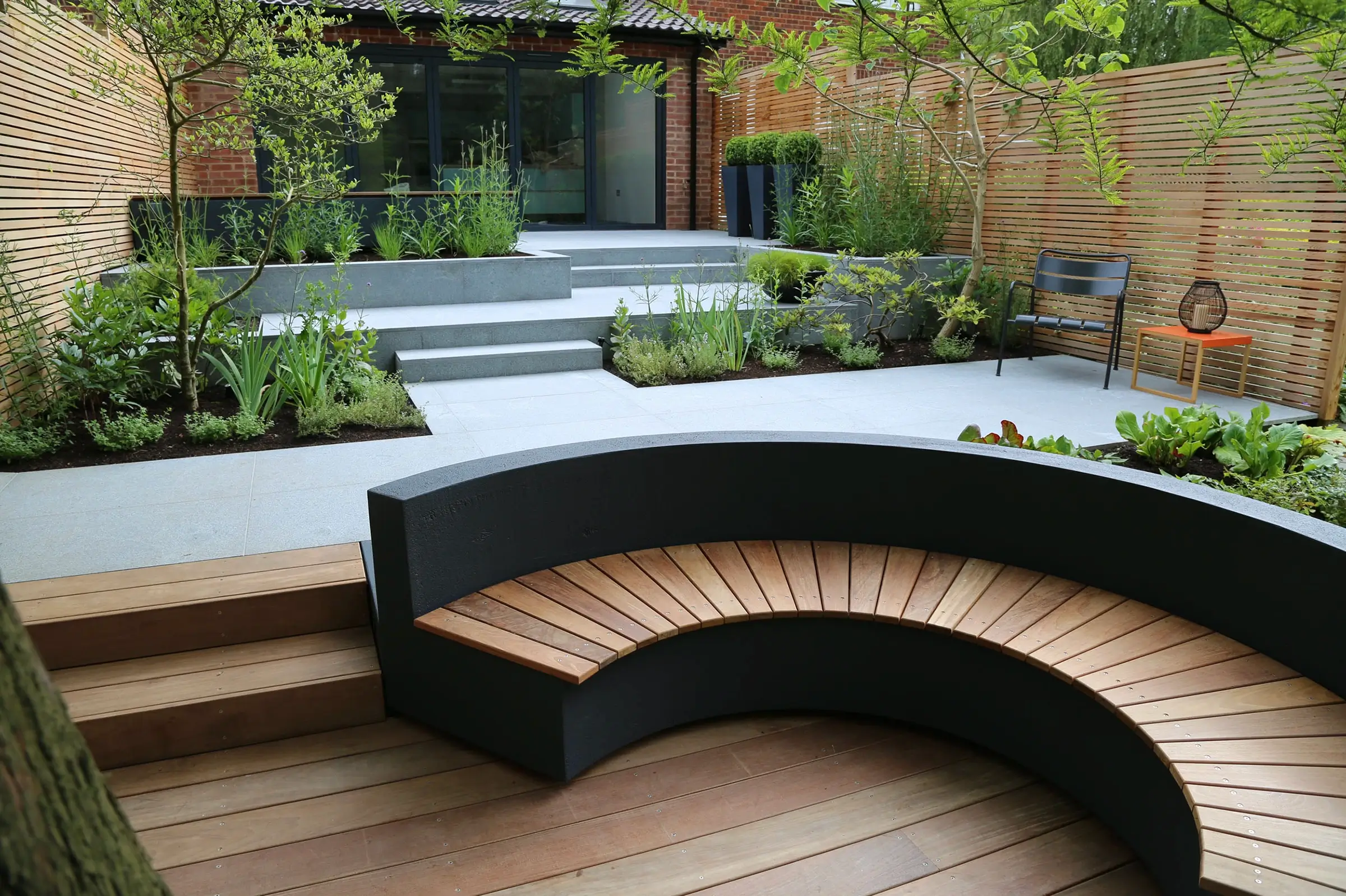 A modern courtyard garden in a dramatic setting.