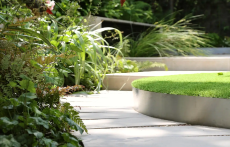 A shady London garden was with limestone paving and splashes of colour