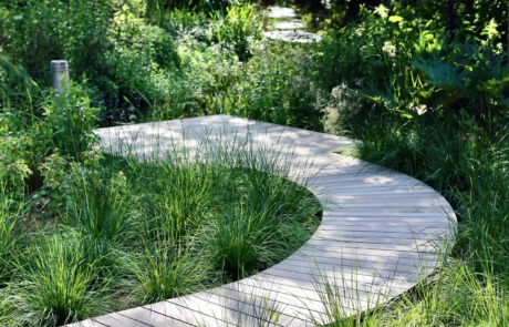 A Hertfordshire garden by a river's edge in the sunshine