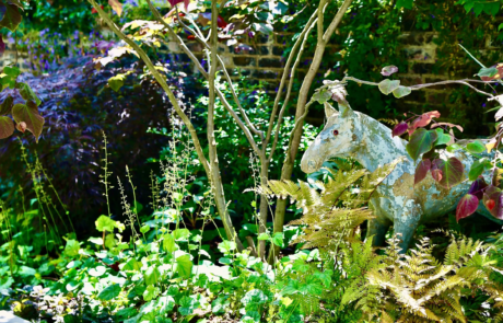 A shady London garden was with limestone paving and splashes of colour